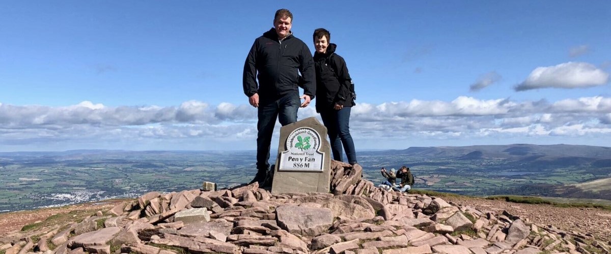 Adrian and Gillian Walker on top of Pen y Fan 1200 x 500