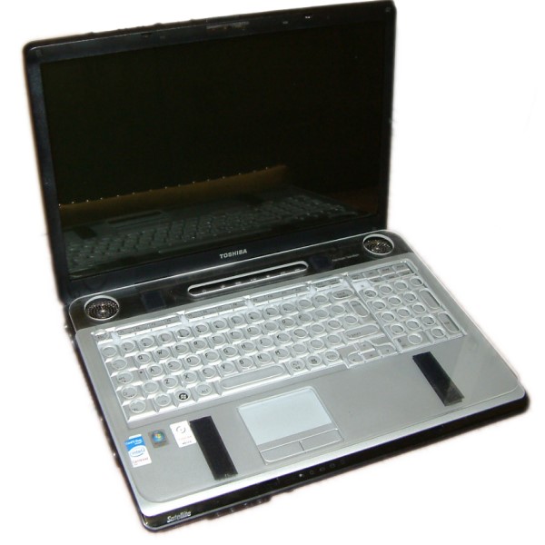 Laptop with Plastic key guard keyboard cover