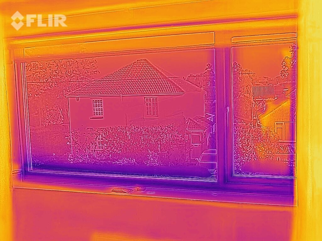 Bedroom window showing condensation effecting heat loss